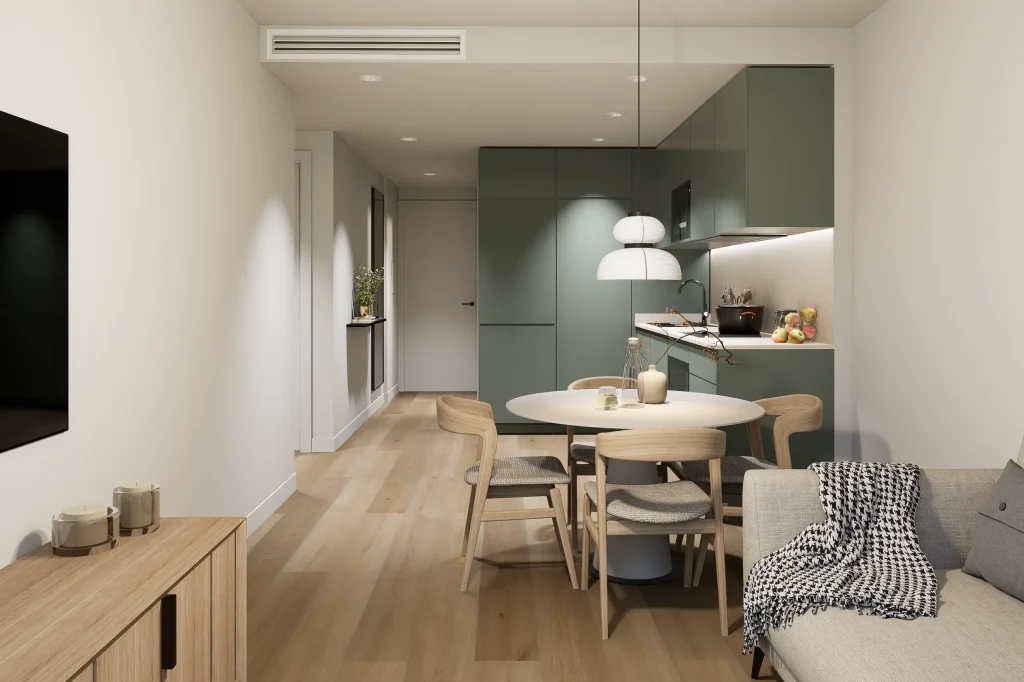 Comedor con cocina integrada en una vivienda de La Noria Homes